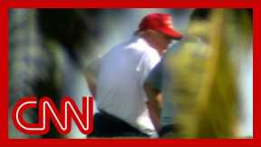 Trump seen golfing after vowing to 'work tirelessly' amid crises