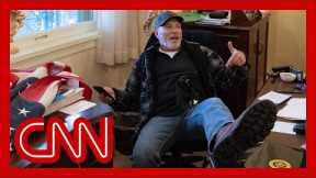 Man seen in viral riot photo at Nancy Pelosi's desk arrested, officials say