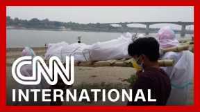 Makeshift crematoriums are built as India's crisis worsens