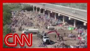 CNN reporter shows what has changed at mass migrant camp
