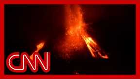 Blocks of lava as large as buildings roll from volcano