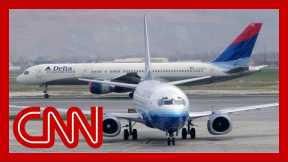 Omicron surge leads to hundreds of canceled flights on Christmas Eve