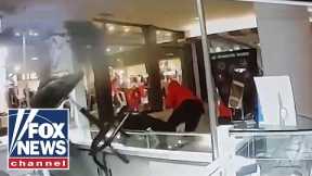 Woman uses stool to stop 'smash-and-grab' robbery at jewelry store