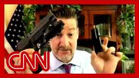 Lawmaker pulls out weapons on webcam: 'I can do whatever I want with my guns'