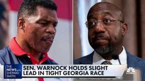 Sen. Warnock holds slight lead in tight Georgia race