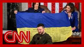 Zelensky unveils Ukraine battle flag during speech to Congress