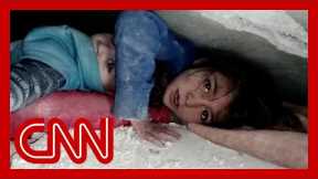 Video shows trapped child comfort sibling under rubble in Syria