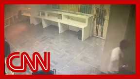 Video shows detainees locked behind gates as fire breaks out in detention center