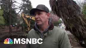 California flood waters wash out roads, isolate communities