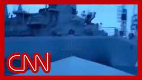 Video shows Russian warship seemingly hit by unmanned surface vessel