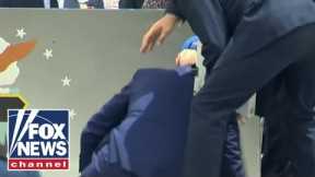 Biden falls during graduation ceremony