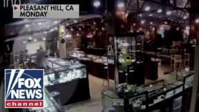 Elderly worker pulls gun on would-be robbers