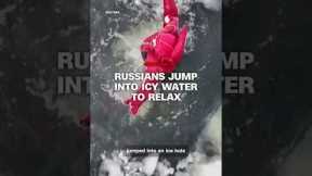 Russians jump into icy water to relax